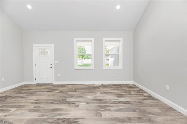 317 Styers Rd, Winston-Salem, NC 27105 - spare room with recessed lighting, baseboards, vaulted ceiling, and wood finished floors