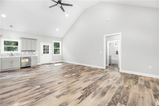 317 Styers Rd, Winston-Salem, NC 27105 - unfurnished living room featuring high vaulted ceiling, ceiling fan, light wood-style flooring, and a wealth of natural light