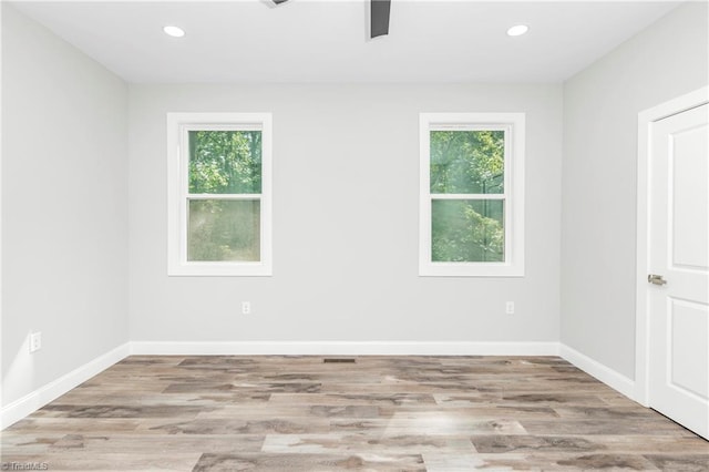 317 Styers Rd, Winston-Salem, NC 27105 - unfurnished room with baseboards, plenty of natural light, and wood finished floors