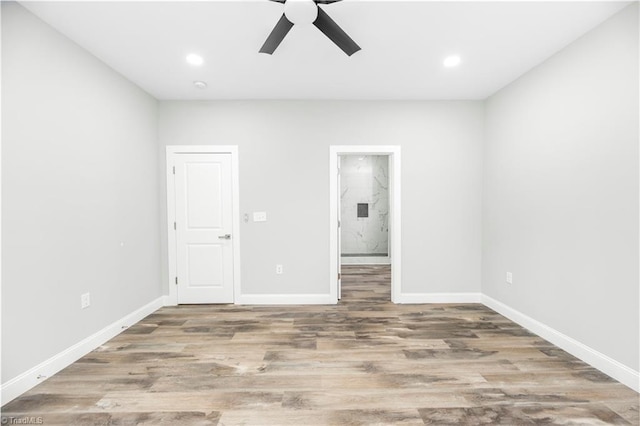 317 Styers Rd, Winston-Salem, NC 27105 - unfurnished bedroom with ceiling fan, wood finished floors, baseboards, connected bathroom, and recessed lighting