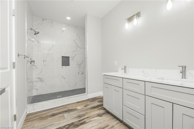 317 Styers Rd, Winston-Salem, NC 27105 - full bathroom with a sink, a marble finish shower, baseboards, and wood finished floors