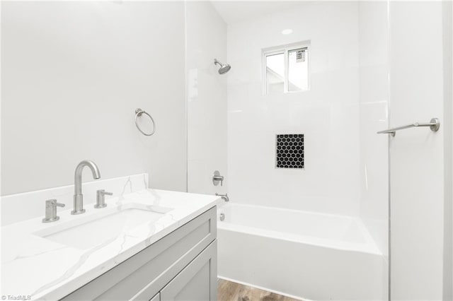 317 Styers Rd, Winston-Salem, NC 27105 - bathroom with vanity, wood finished floors, and bathing tub / shower combination