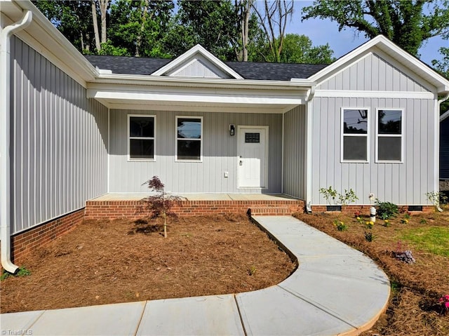 317 Styers Rd, Winston-Salem, NC 27105 - view of front of house featuring board and batten siding, roof with shingles, covered porch, and crawl space