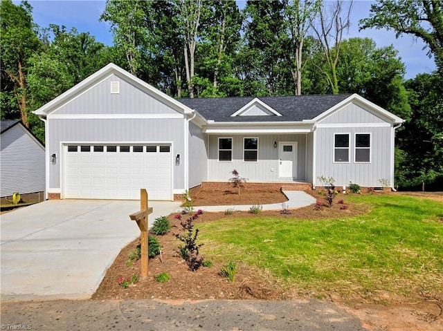 317 Styers Rd, Winston-Salem, NC 27105 - ranch-style house featuring a porch, driveway, roof with shingles, a garage, and a front lawn