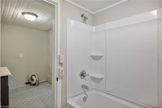 bathroom featuring tile patterned flooring, vanity, and  shower combination