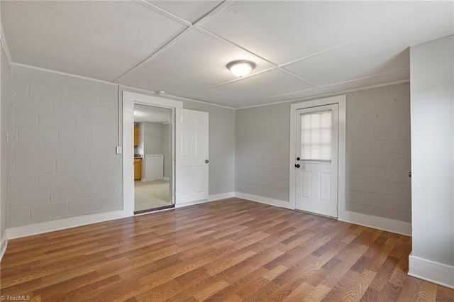 unfurnished room with hardwood / wood-style floors