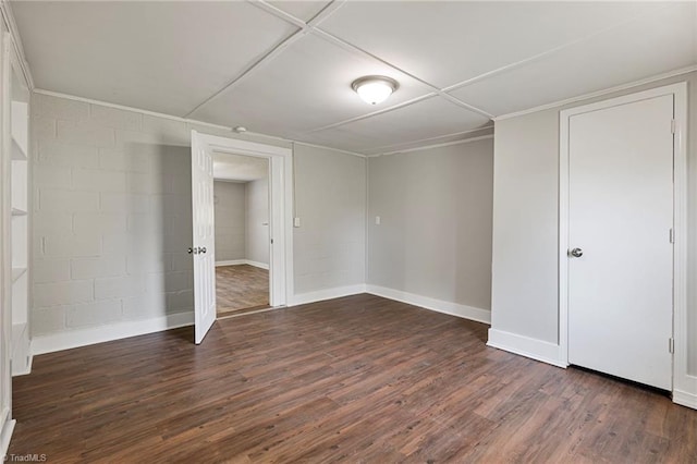 unfurnished bedroom featuring dark hardwood / wood-style floors