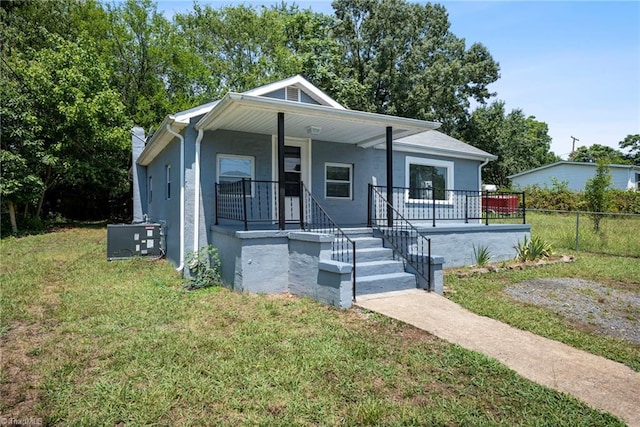 view of front facade with a porch and a front yard