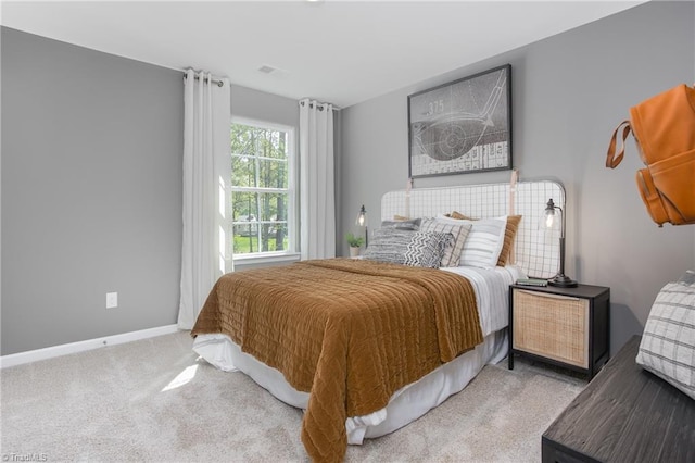 bedroom with light carpet