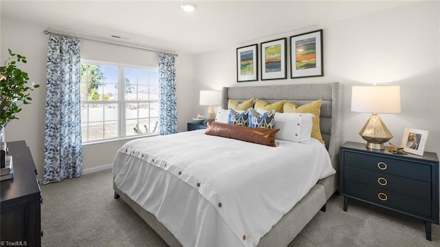 carpeted bedroom featuring visible vents and baseboards