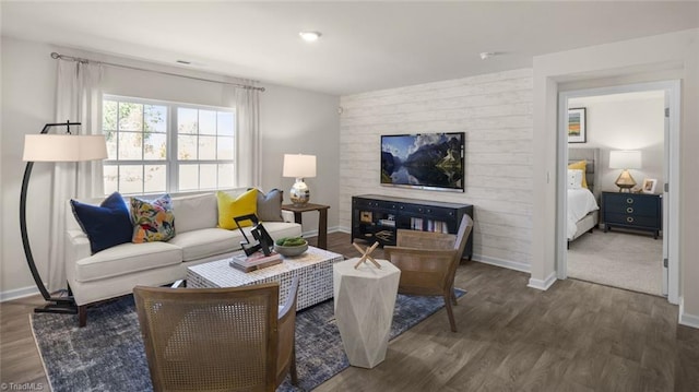 living area with wood finished floors and baseboards