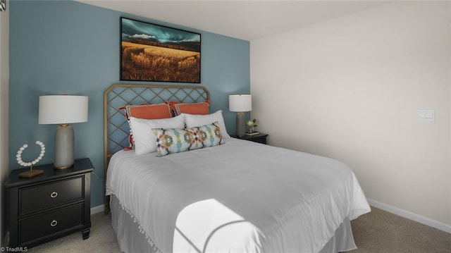 carpeted bedroom with baseboards