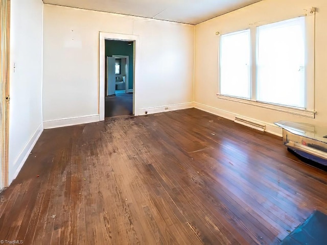 empty room featuring dark hardwood / wood-style flooring