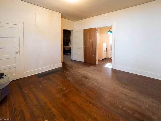 empty room featuring dark hardwood / wood-style floors