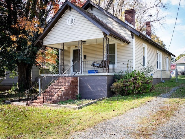 bungalow-style house featuring a front yard and a porch