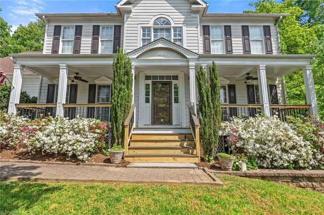 view of front of property with a ceiling fan and a porch