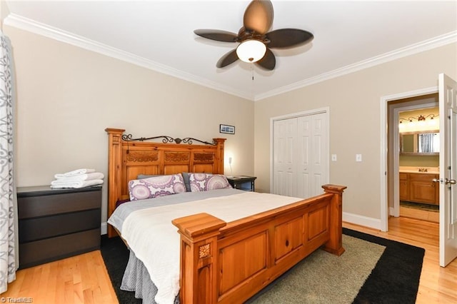 bedroom with crown molding, light wood-style floors, a closet, ceiling fan, and baseboards