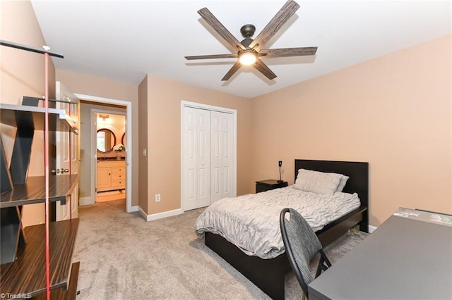 bedroom featuring carpet floors, a closet, baseboards, and a ceiling fan