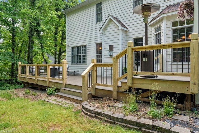 back of property featuring a wooden deck