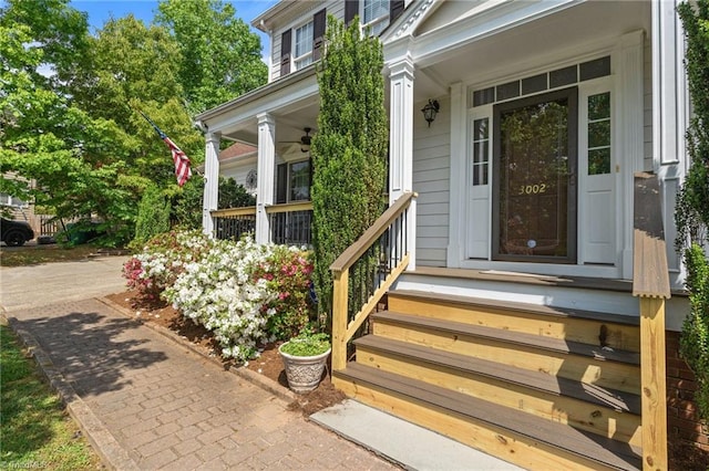 view of exterior entry with a porch