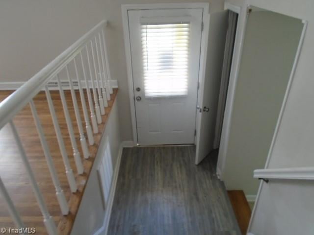 doorway to outside featuring dark hardwood / wood-style floors