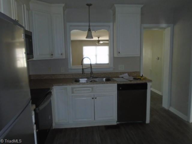 kitchen featuring sink, stainless steel appliances, and white cabinets