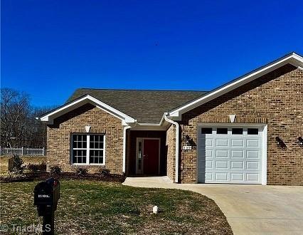 single story home featuring a garage