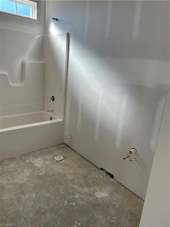 bathroom featuring concrete flooring