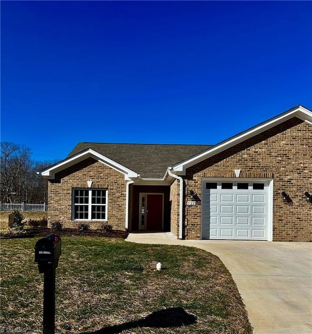 ranch-style house featuring a garage