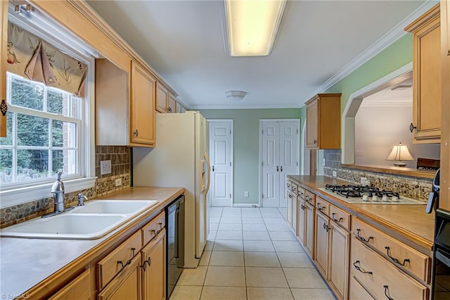 kitchen with ornamental molding, stainless steel gas cooktop, light tile patterned floors, sink, and black dishwasher