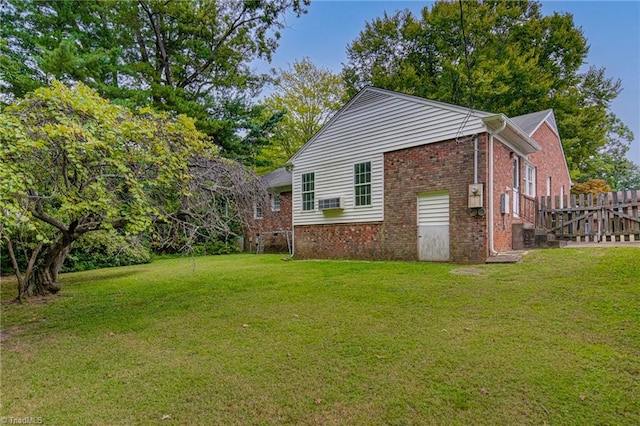 view of side of property with a yard