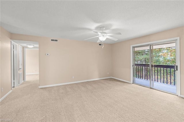 empty room with light colored carpet and ceiling fan