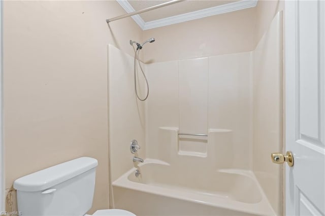 bathroom with toilet, shower / tub combination, and ornamental molding