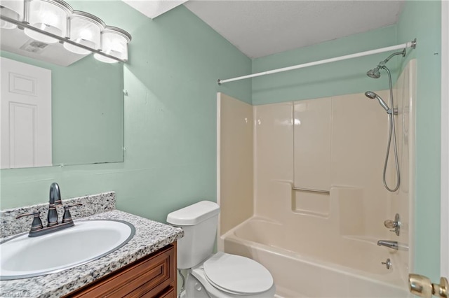 full bathroom featuring vanity, bathing tub / shower combination, and toilet