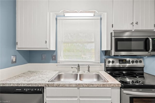 1040 Rock Knoll Ct Unit 193, Winston-Salem, NC 27107 - kitchen with appliances with stainless steel finishes, a sink, and white cabinets