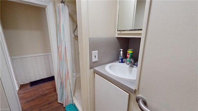 full bath featuring vanity and wood finished floors