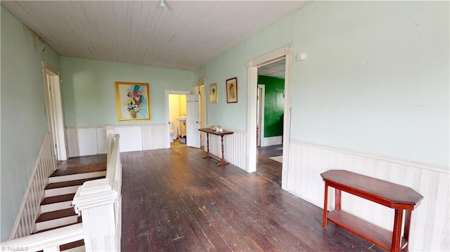 hall with wainscoting and wood finished floors