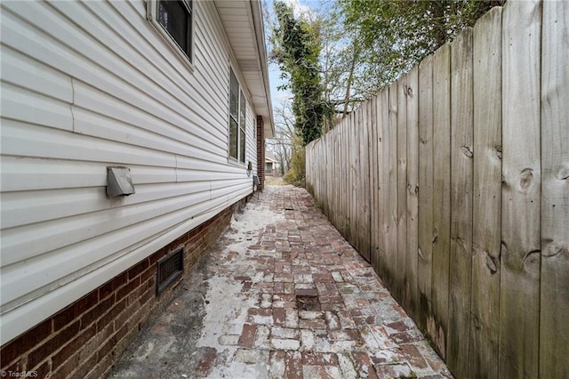 view of home's exterior with fence