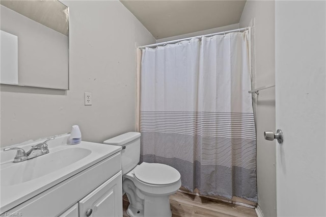 full bath with a shower with curtain, vanity, toilet, and wood finished floors