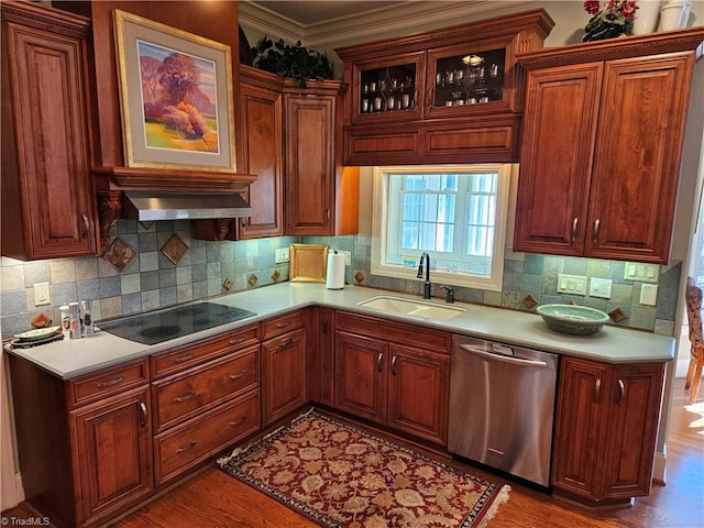 kitchen featuring hardwood / wood-style flooring, tasteful backsplash, black electric stovetop, dishwasher, and sink