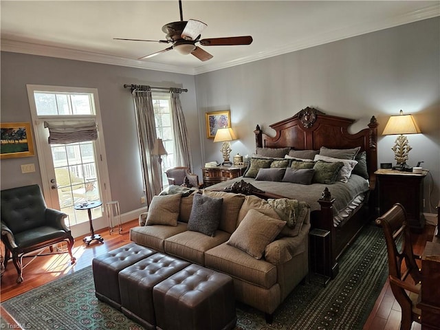 bedroom featuring crown molding, ceiling fan, and dark hardwood / wood-style floors