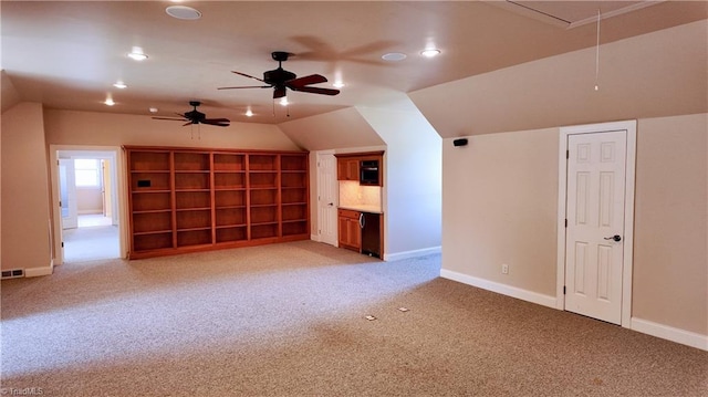 bonus room with light colored carpet, ceiling fan, and lofted ceiling