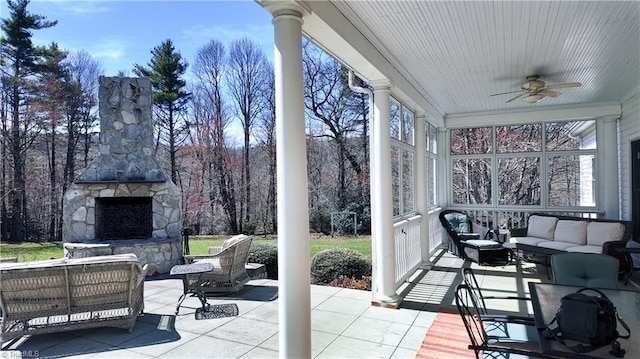 exterior space featuring ceiling fan