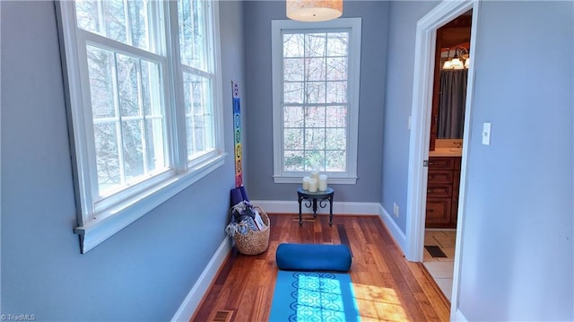 entryway with dark tile floors