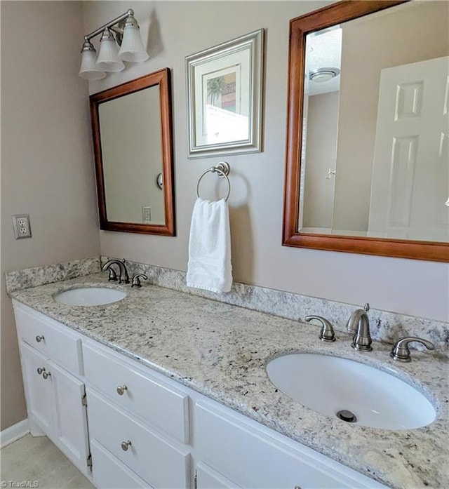 bathroom featuring tile patterned floors and vanity