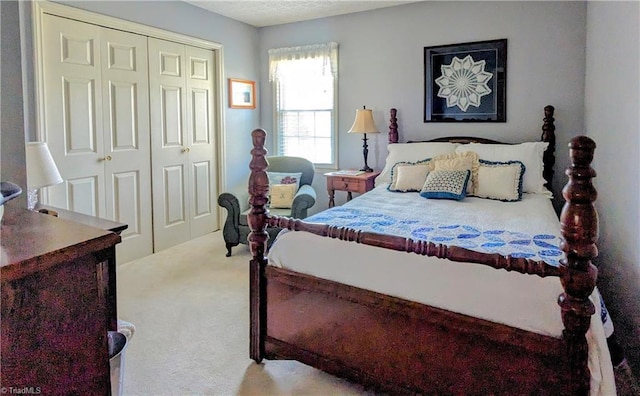 carpeted bedroom featuring a closet