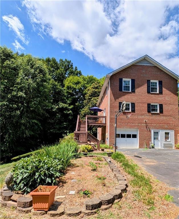 view of property exterior with a garage