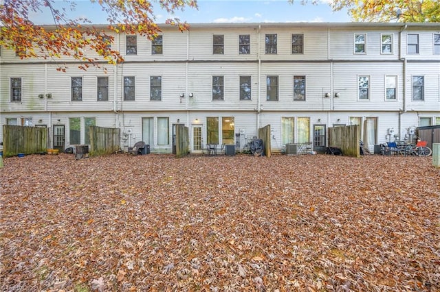 rear view of house featuring central AC unit