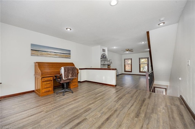 office area with ceiling fan and wood-type flooring