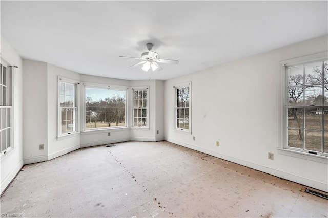 spare room with ceiling fan